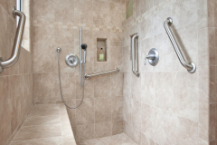 Clear Path
The owner of this roll-in shower has been in a wheelchair due to muscular dystrophy for more than two decades. He specified to remodeler Matt Plaskoff, owner of One Week Bath, in Van Nuys, Calif., exactly where he wanted the bench, grab bars, and hand-held fixture. The bench was built on site of lumber, then waterproofed with the same Schulter-Kerdi membrane used on the shower pan.